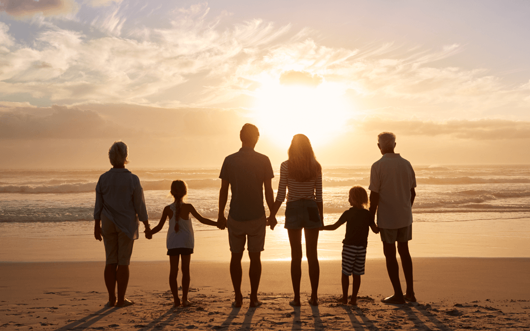 Family -Grandparents, parents and children - looking at the sun set