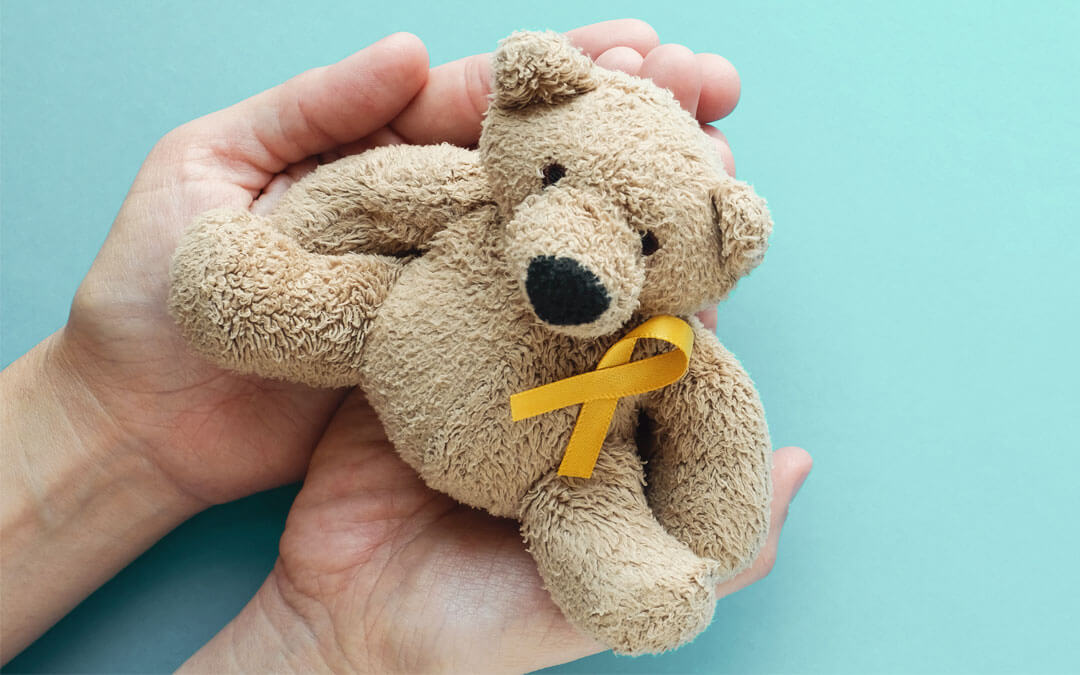 Small teddy with the Childhood Cancer Awareness ribbon