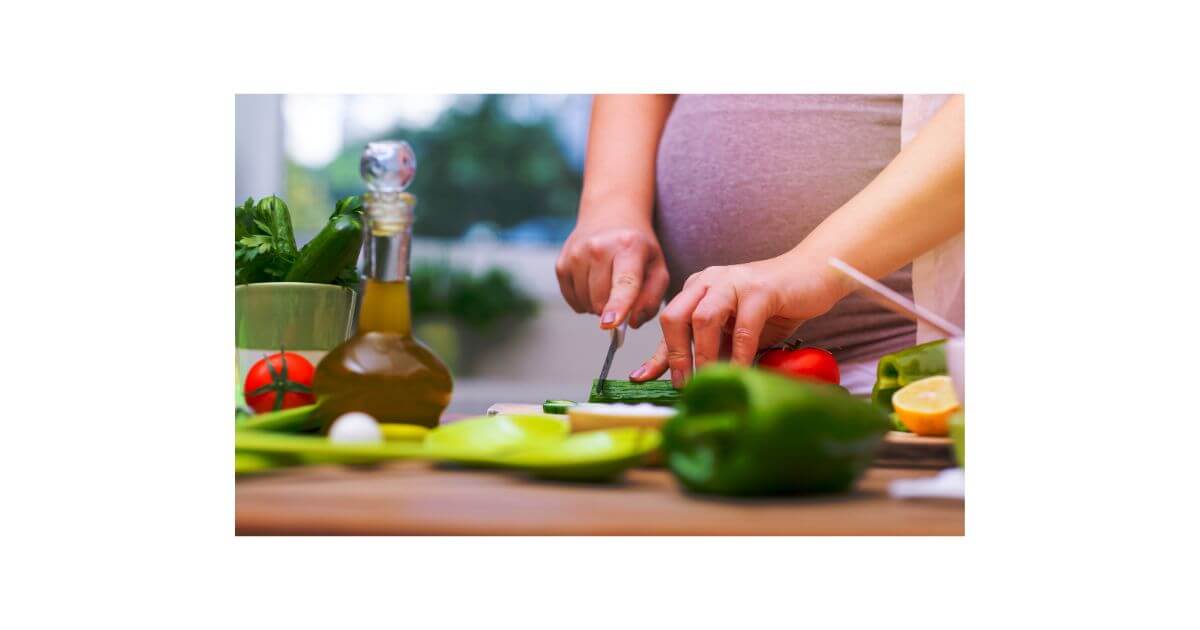 Pregnant female cutting vegetables