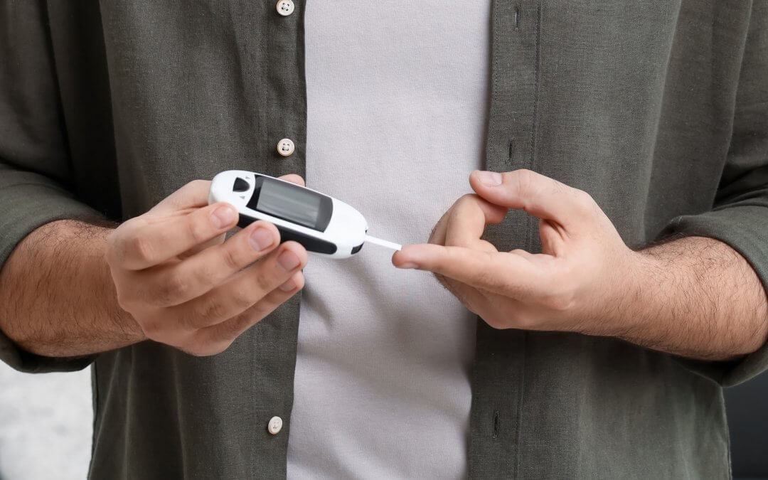 Person managing their type 2 diabetes with a glucose monitor