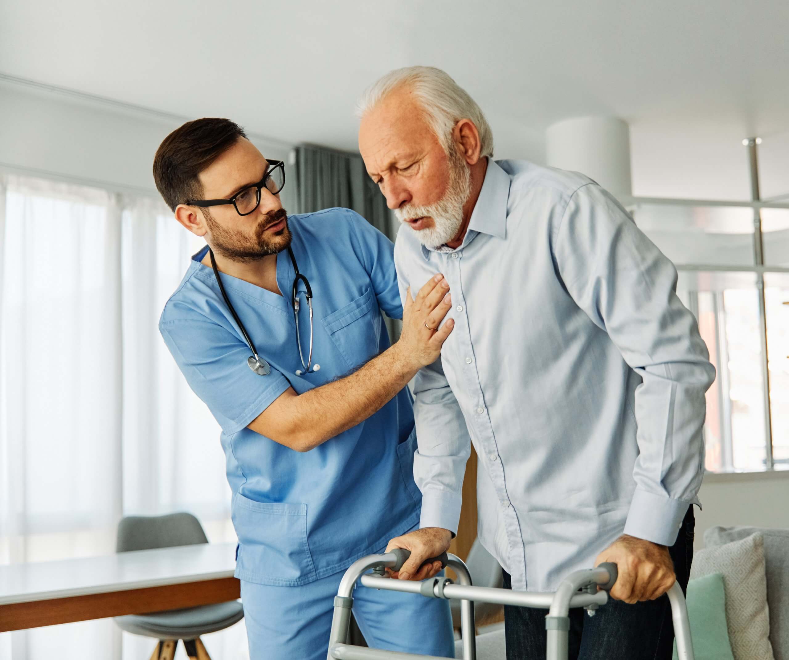 A nurse helping a man with stroke rehabilitation using a walker.