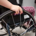 A photo of a child in a wheelchair.